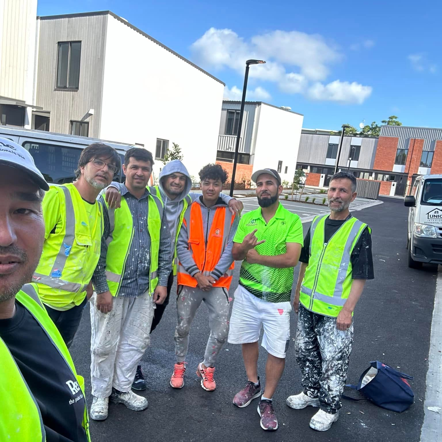 The Rush & Brush crew on a residential job in West Auckland, in branded hi-vis